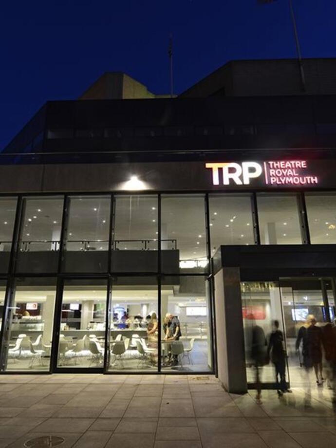 An outdoor nighttime view of the Theatre Royal Plymouth