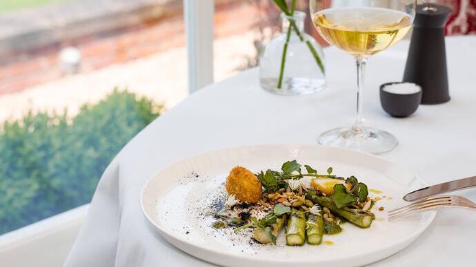 Plate of food on a set table