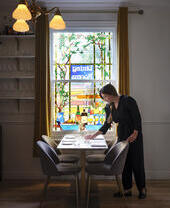 Woman setting a table in a restaurant