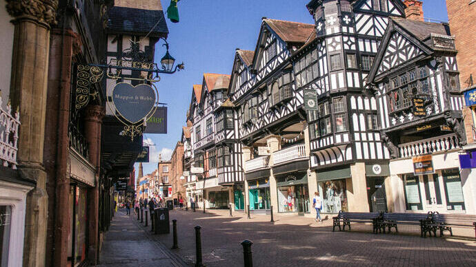 City high street with historic buildings and shops