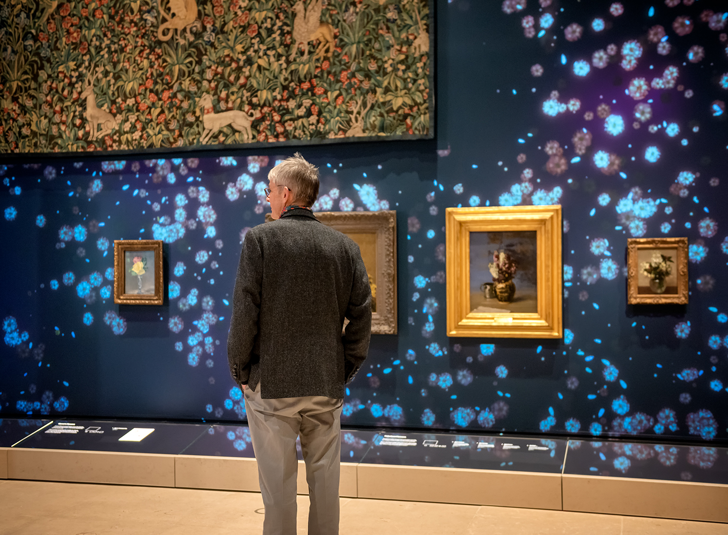 A person looking at artworks in a gallery in Glasgow