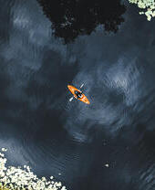 An overhead view of a person kayaking down a river in Leicestershire