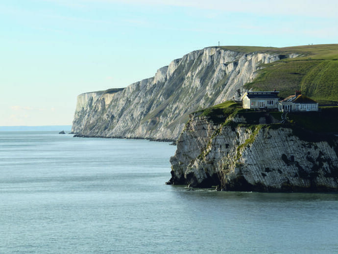 Houses on chalk cliffs overlooking the ocean