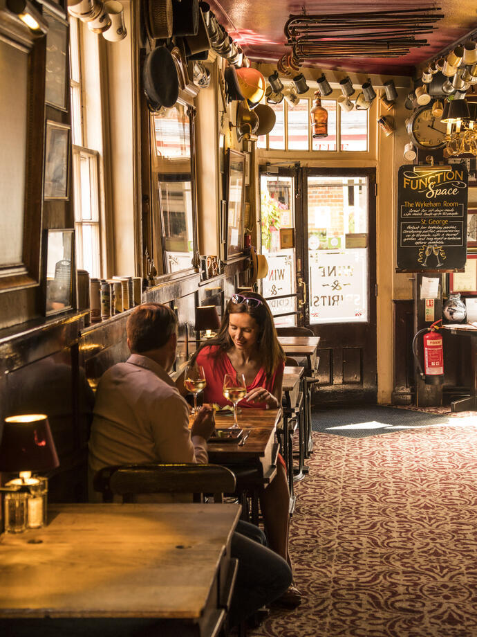 A couple in a traditional pub having lunch.
