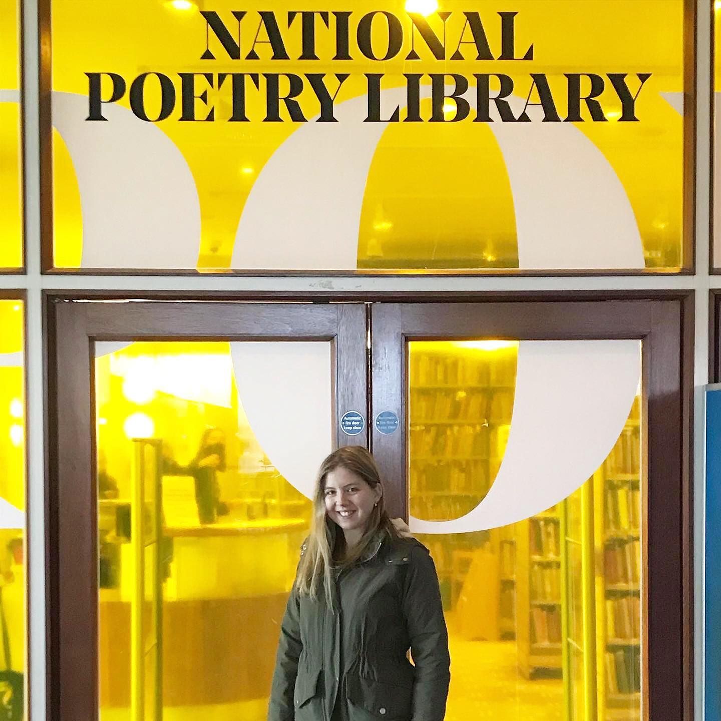A woman standing outside the National Poetry Library at the London Literary Festival