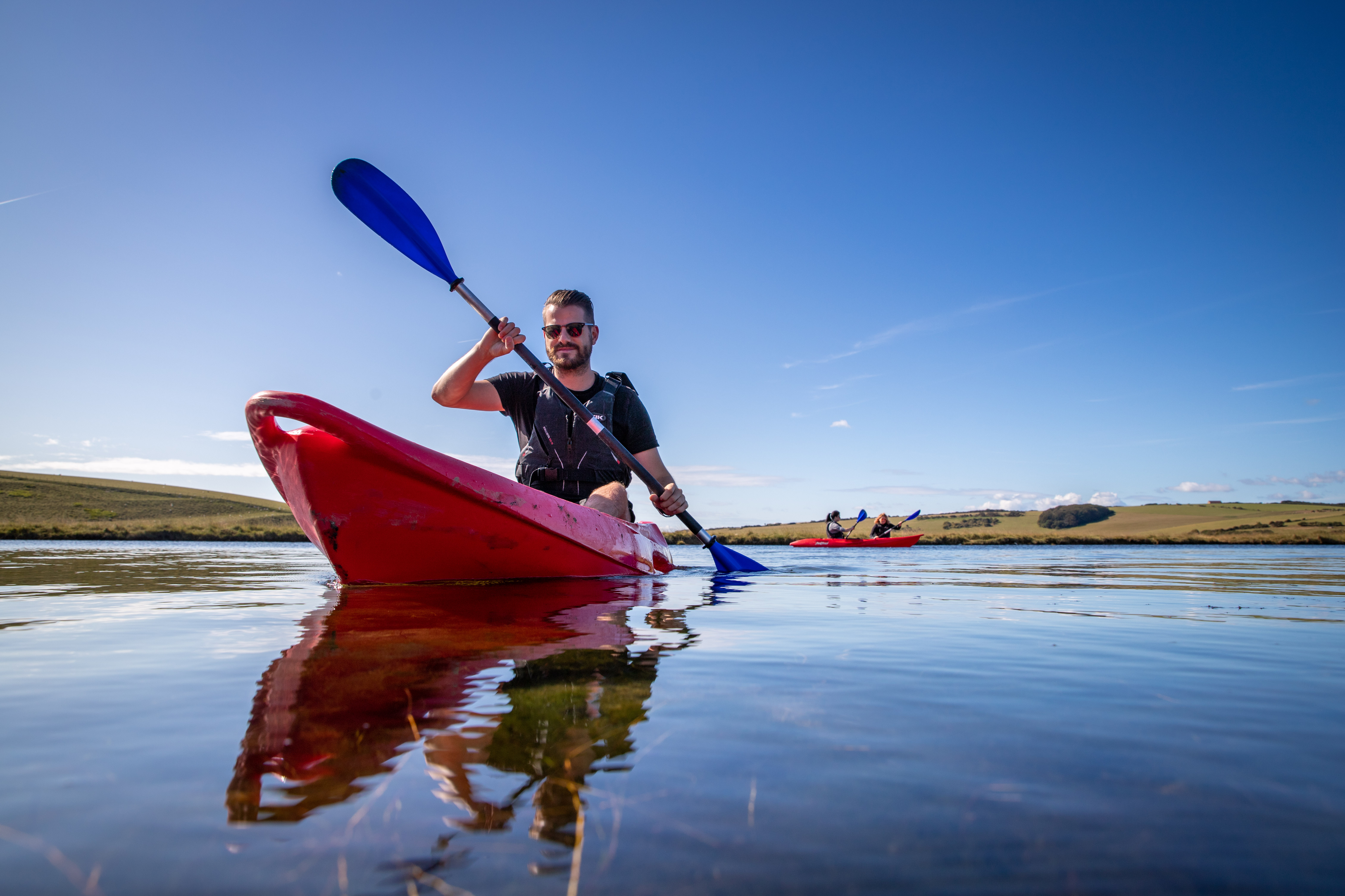 Man kayaking on a sunny day
