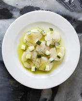 A fine dining plate of scallop cevice.