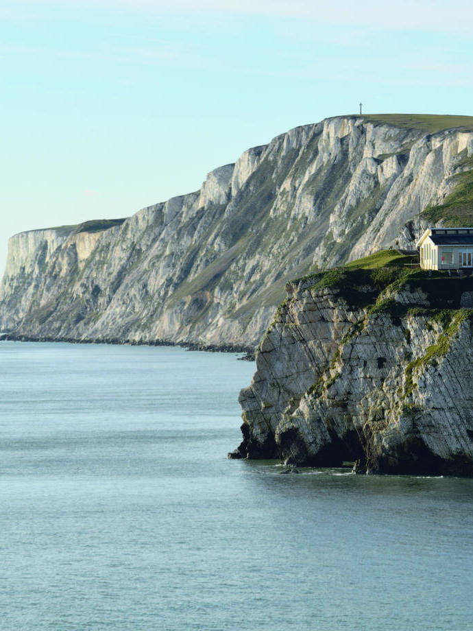 Houses on chalk cliffs overlooking the ocean