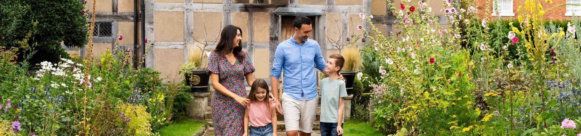 A family walking together outside heritage building