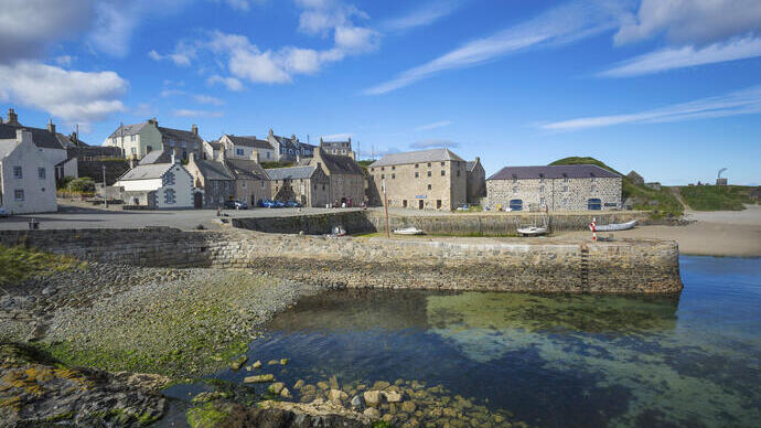 A landscape shot of a harbour town on a sunny day.