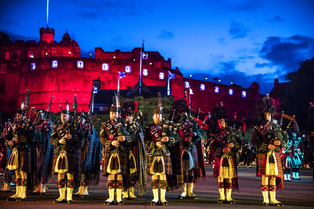 Marching band and light show projecting onto the castle