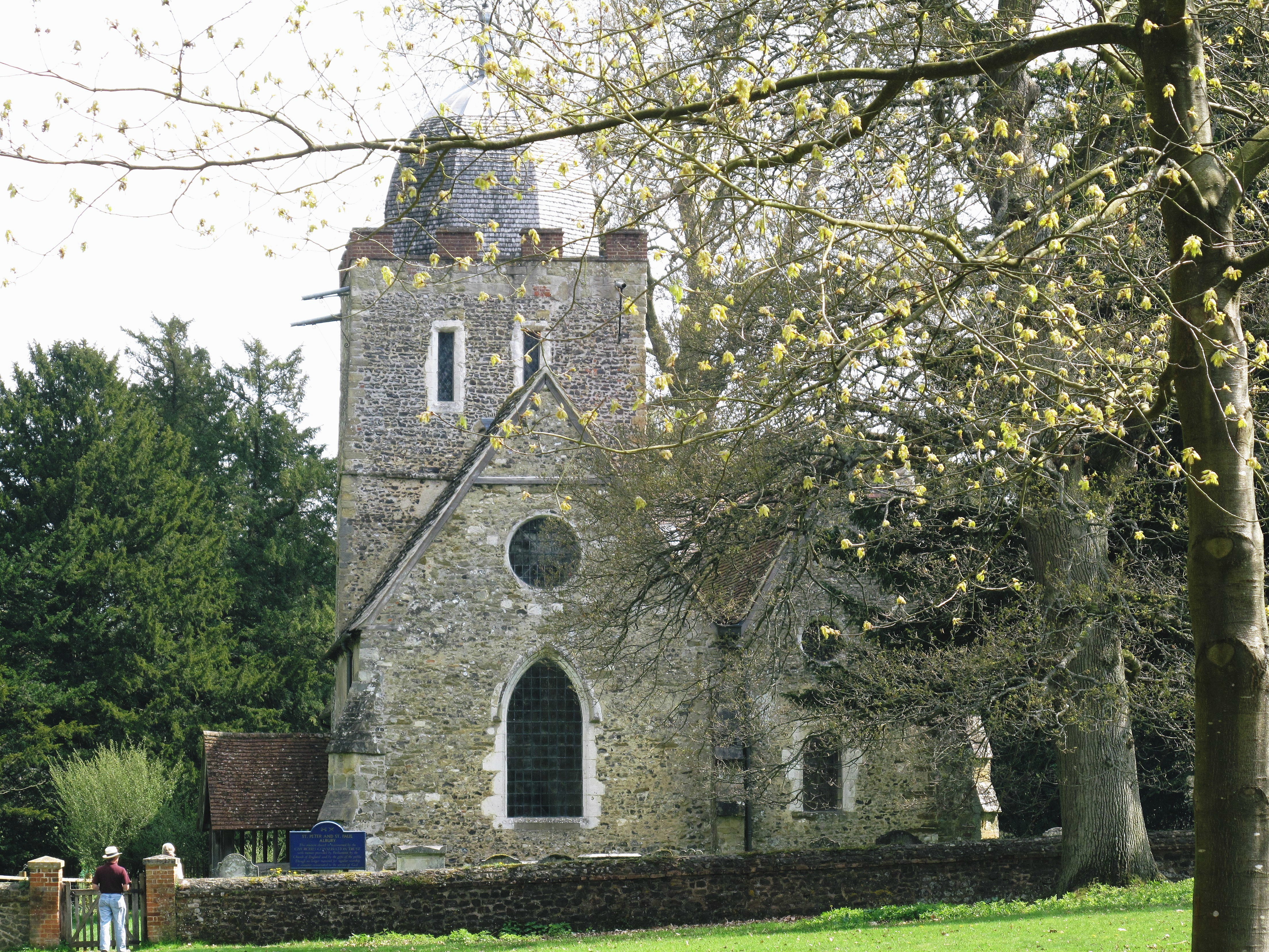 Old Saxon church with blossom tree in the foreground