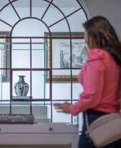 A woman and a man tour a museum