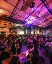 Crowds of people eating and drinking on a night out in the Peddler Market, Sheffield