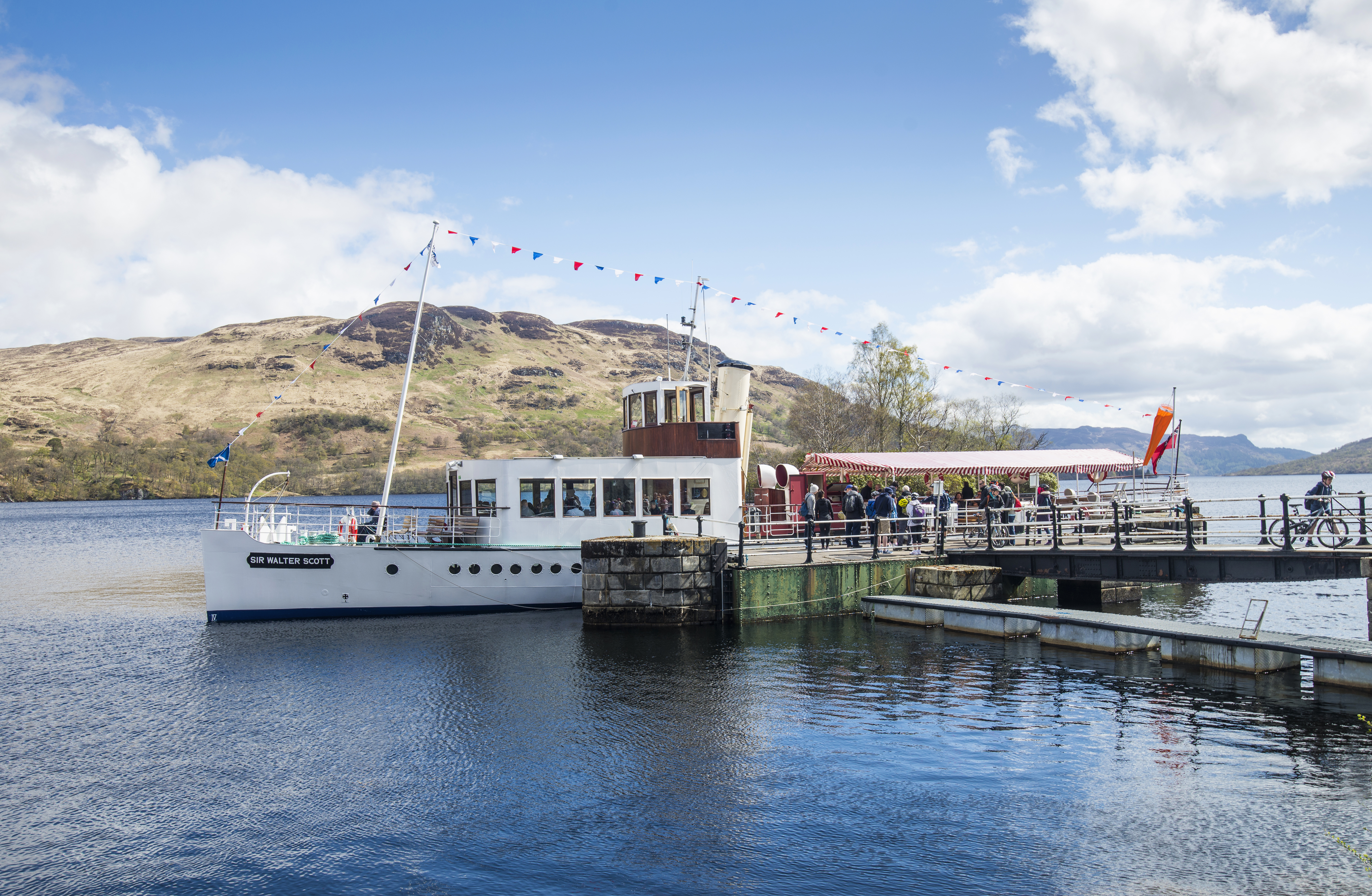 Steam boat docked on a lake