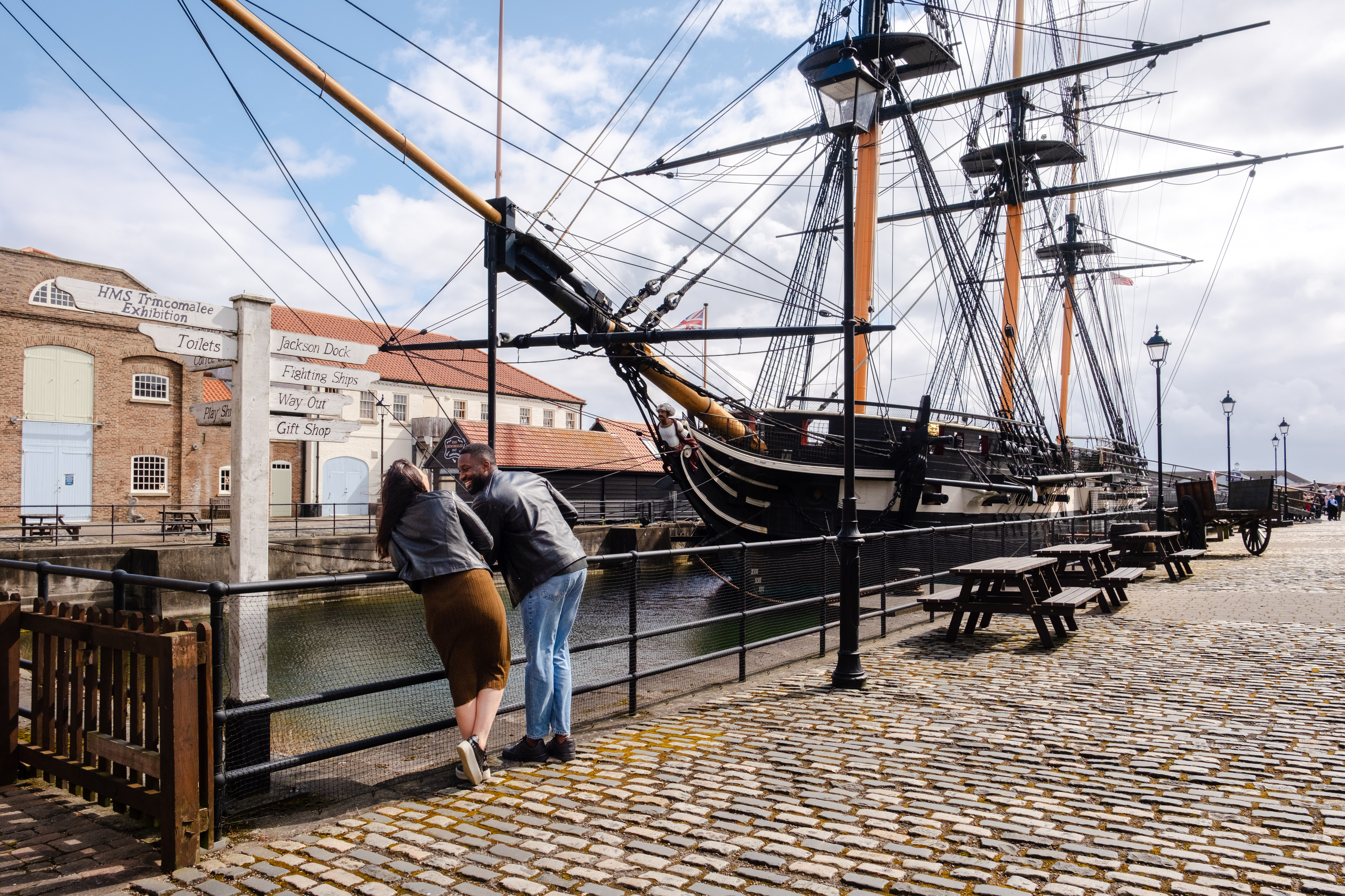 A woman and a man visiting a heritage naval museum