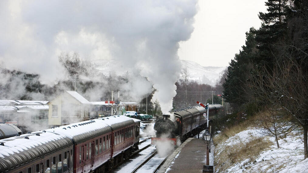 A steam train at train station