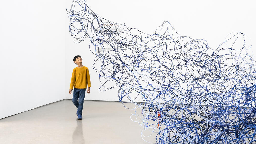 A child looking at an art exhibit in Leeds Art Gallery