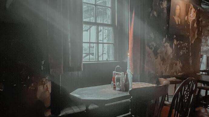 Atmospheric view inside old Drovers Inn Hotel dining area