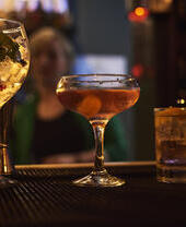 Close up of selection of cocktails on bar counter.
