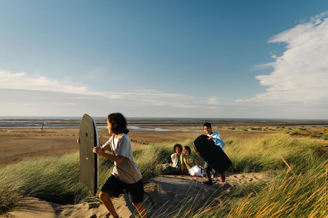 A family enjoy a day out in the sand dunes
