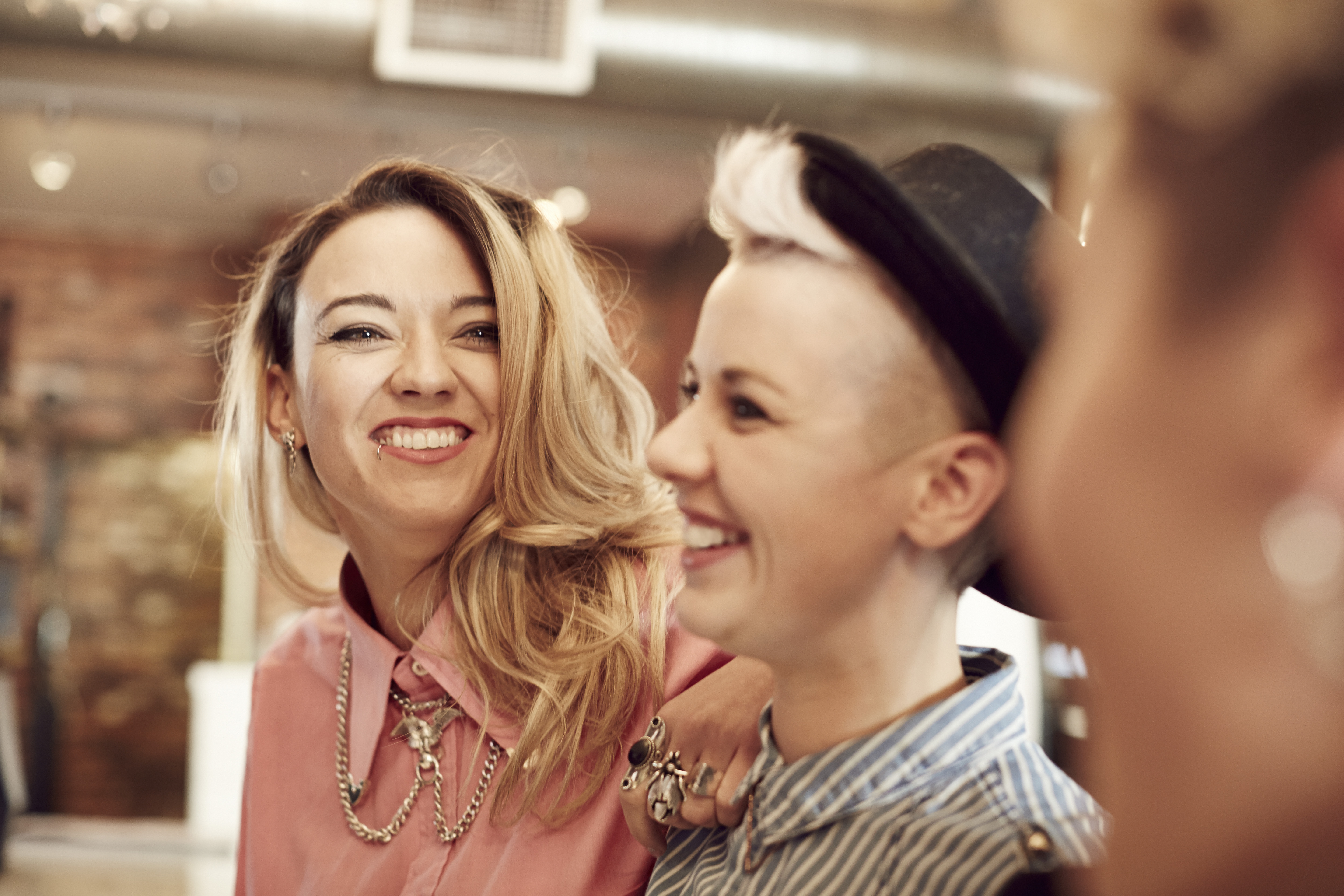 Smiling lesbian couple in a bar