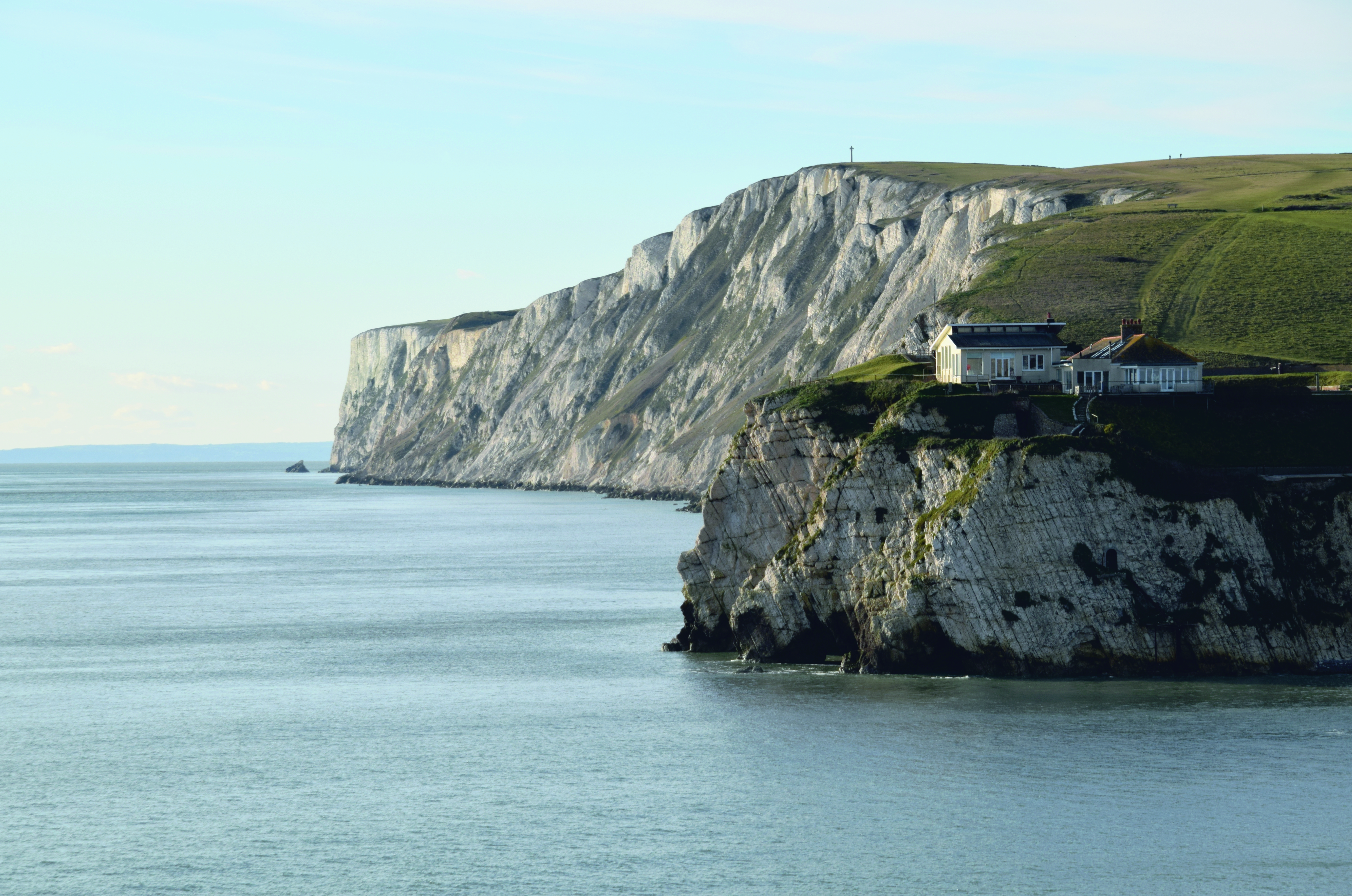 Houses on chalk cliffs overlooking the ocean