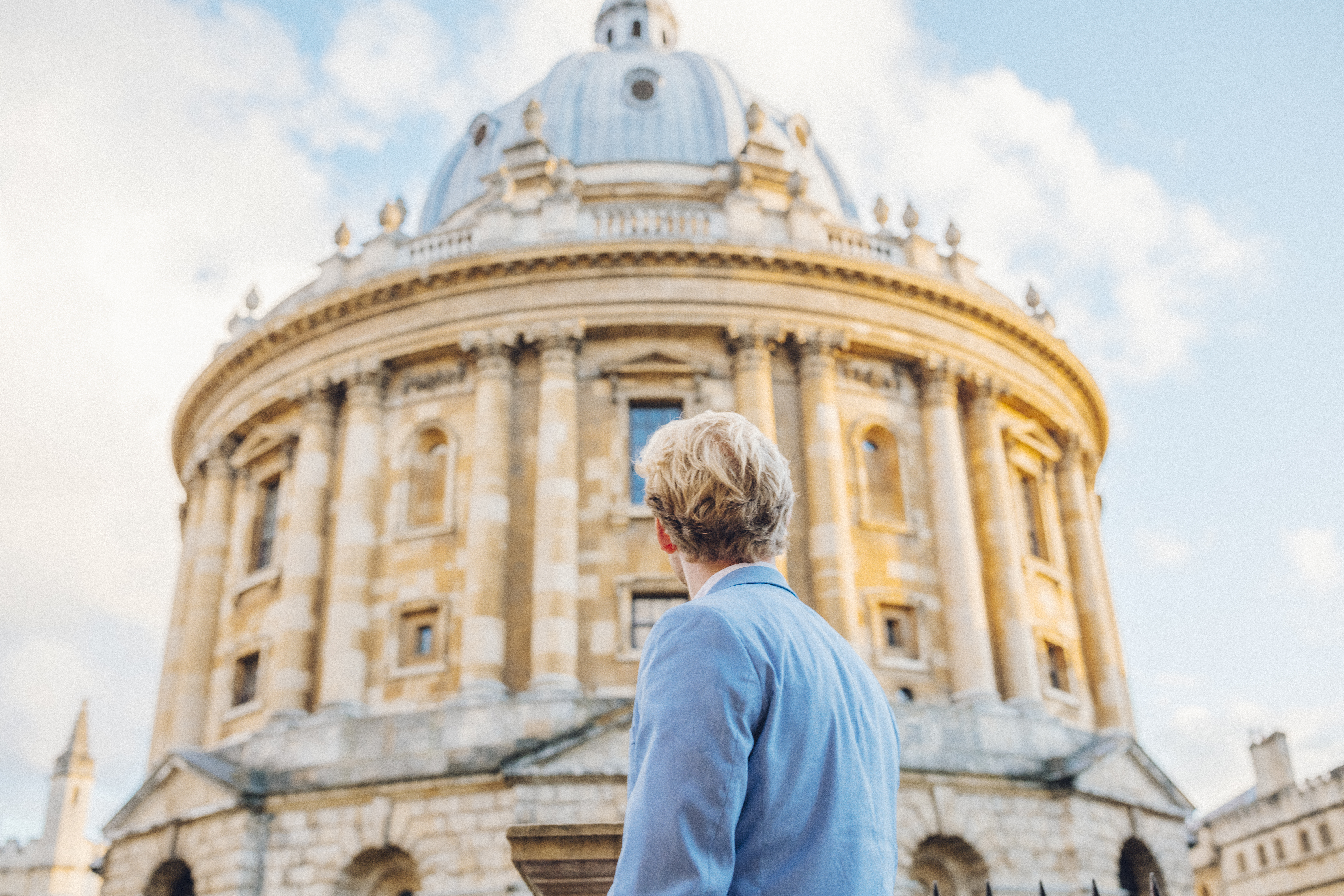 Man looking up at an historical building
