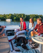 A family relaxing on a boat in the Broads