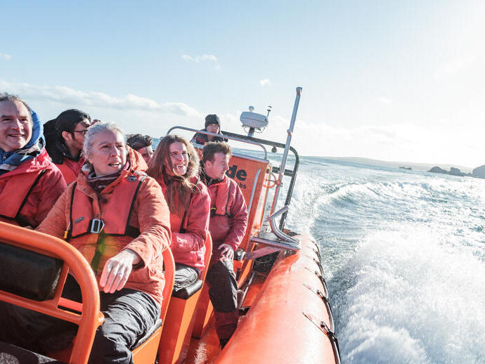 Group of people on an inflatable motorboat at sea