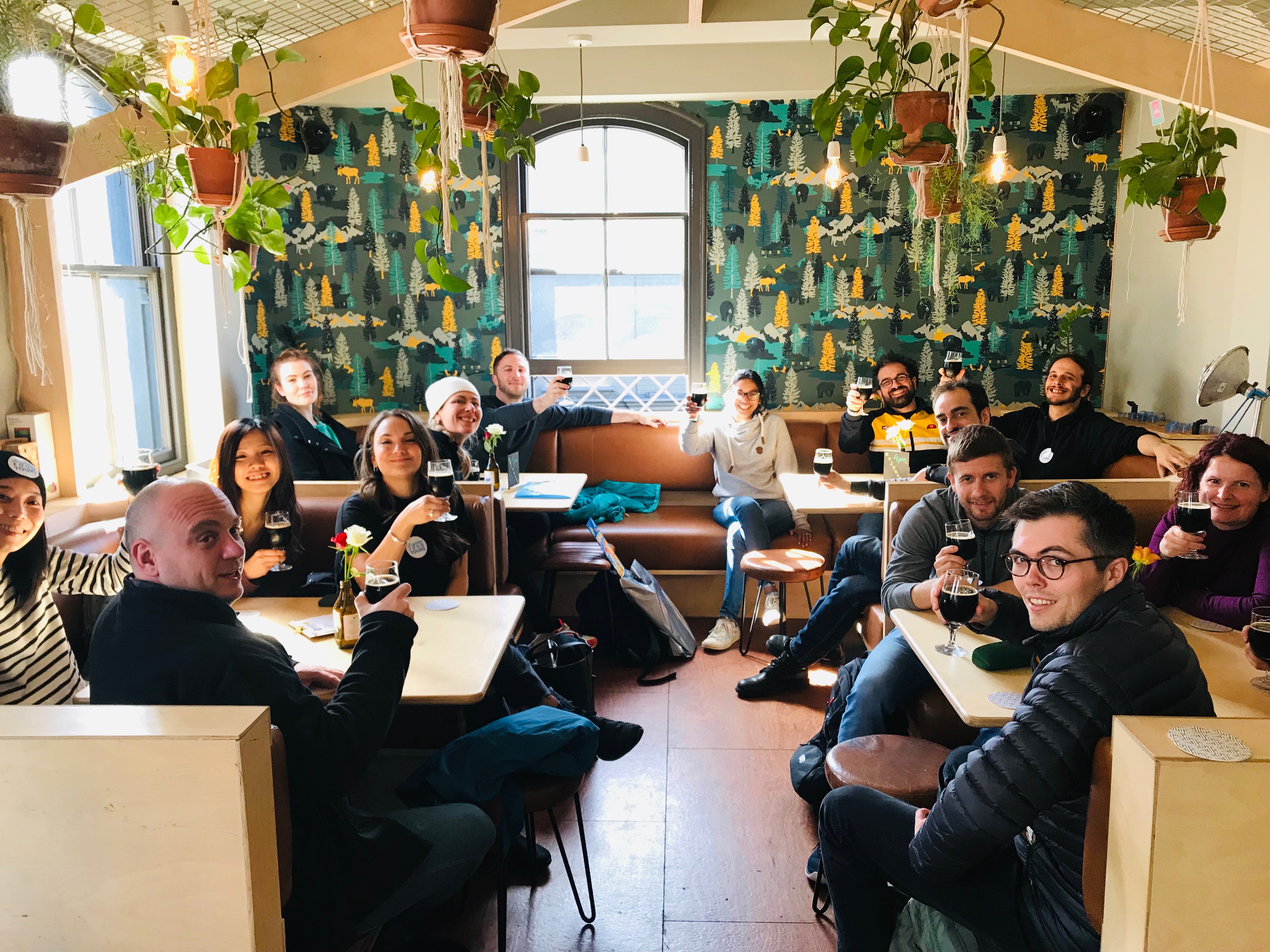 A group of people drinking wine as part of a food tour in Brighton