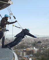 People at the top of a stadium climbing experience