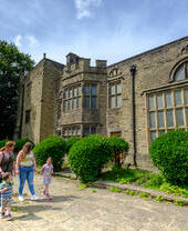 Family walking outside a heritage building