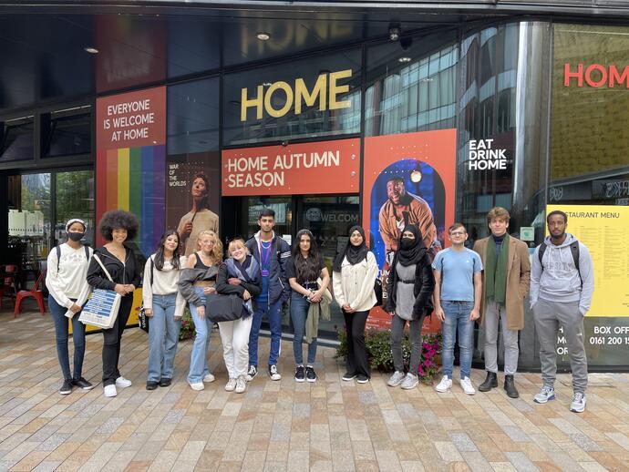 A group of people on a music themed tour of Manchester