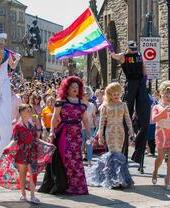 Crowds of people walking the streets of Durham for Durham Pride