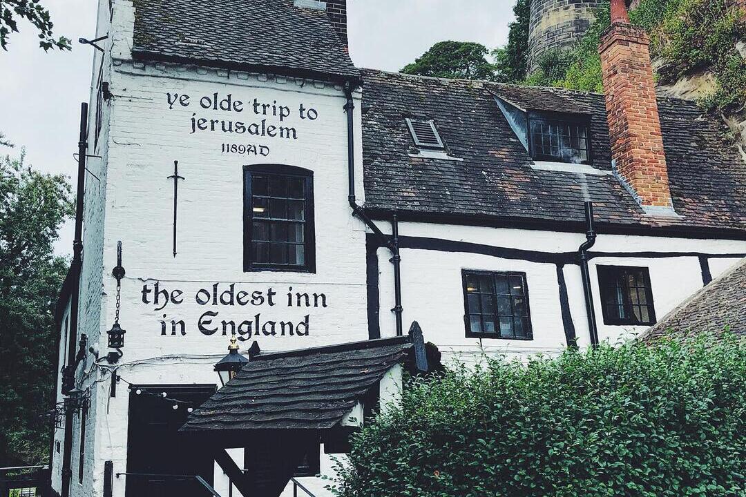 Spring- View of pub with writing on its outside wall saying 'the oldest inn in England'