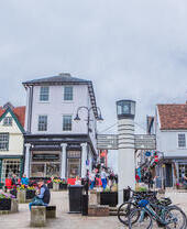 Crowds of people walking down a shopping street in Bury St Edmunds