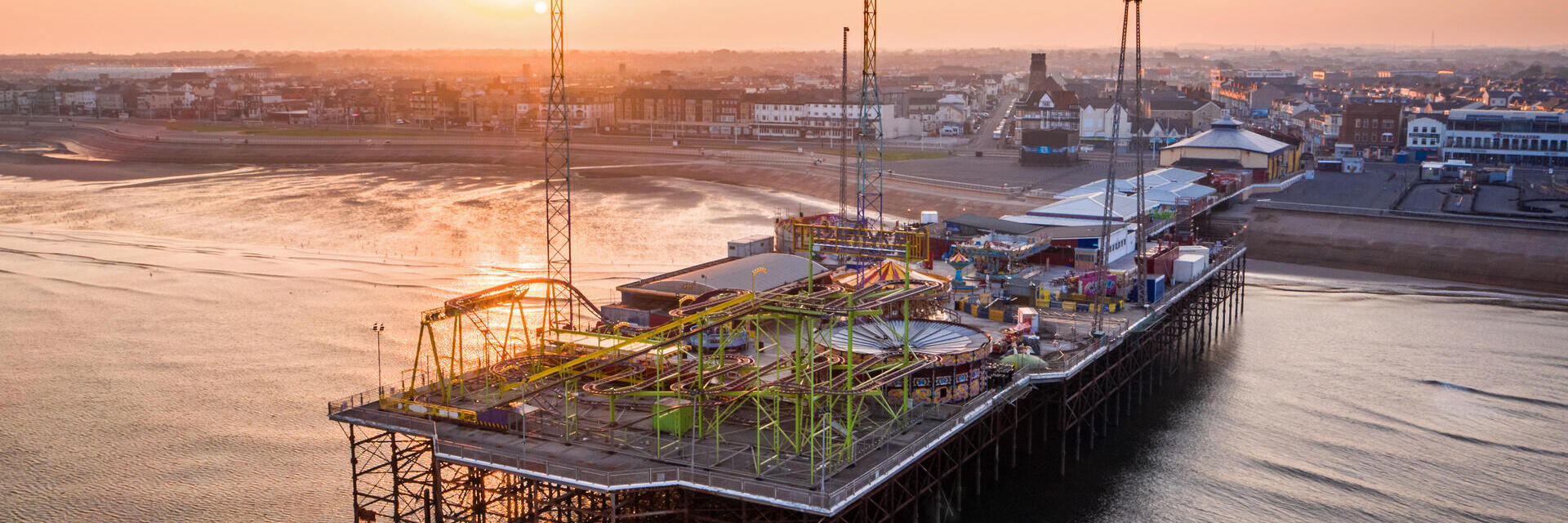 A seaside pier and funfair.