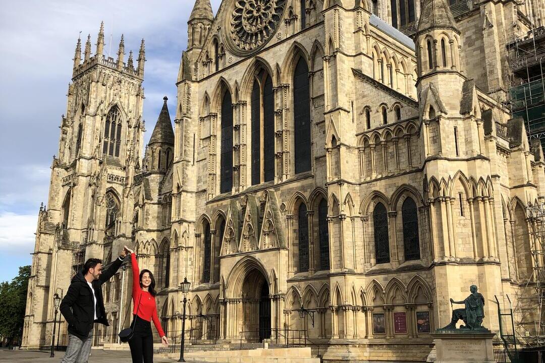 Man and woman dancing outside an historic building
