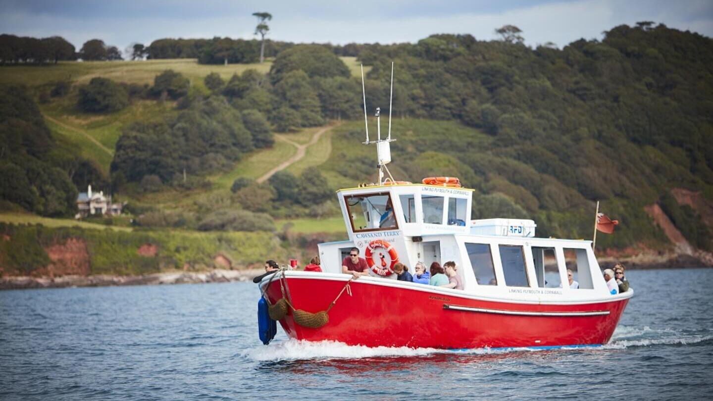 A group of people on a boat trip near the coast of Plymouth
