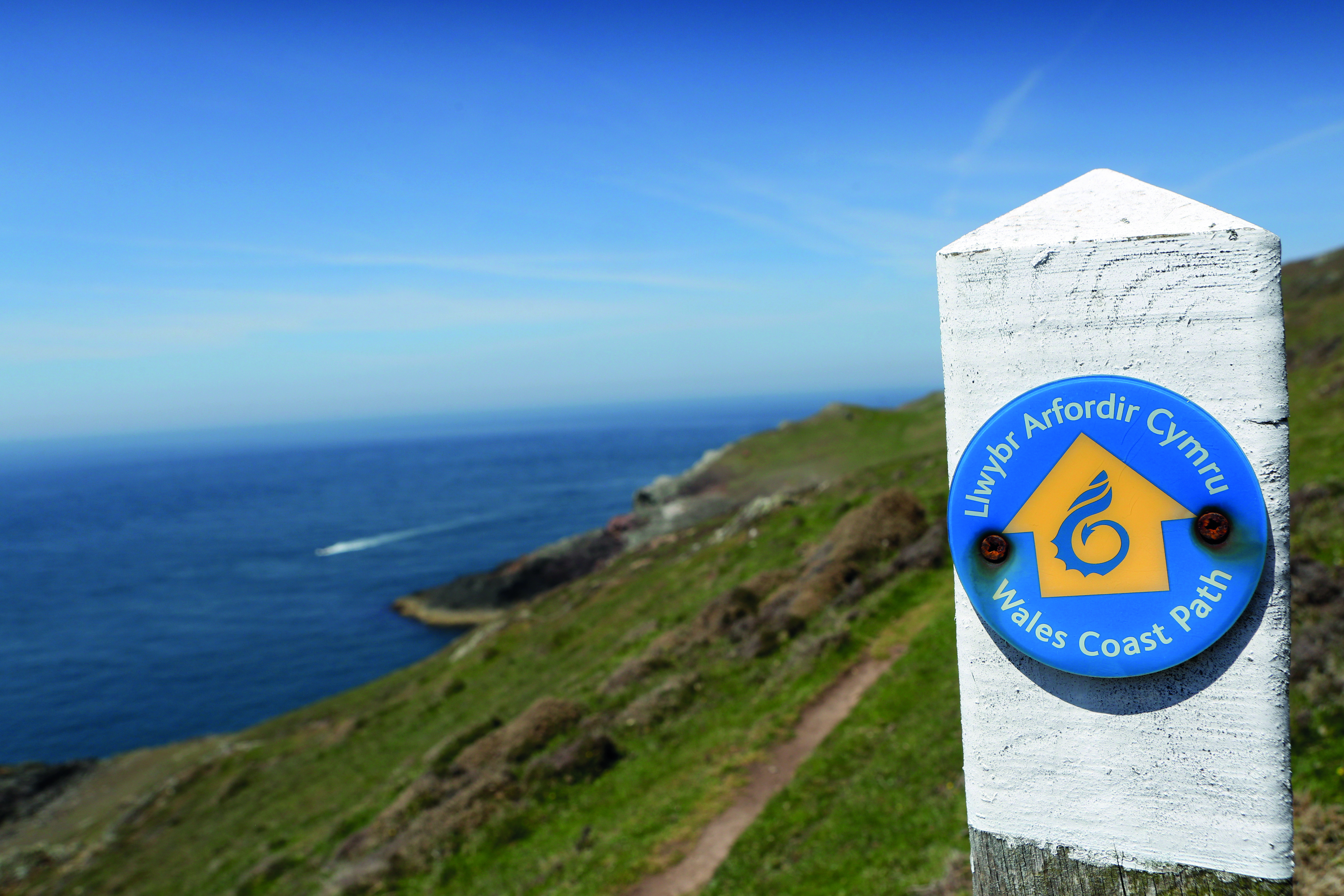 Marker alongside a coastal walking trail