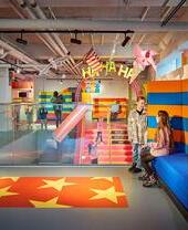 Children playing in a colourful play area