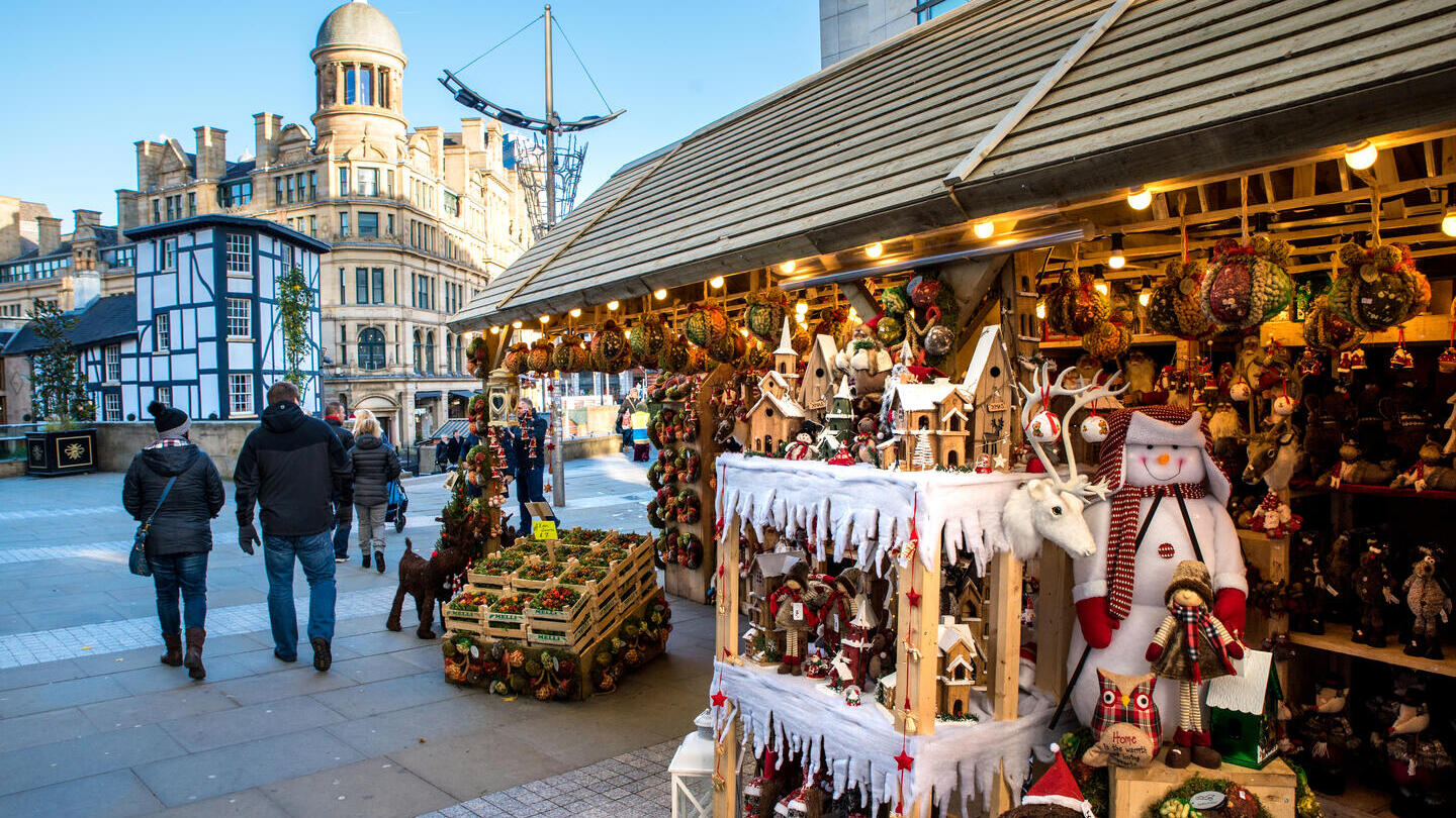 Christmas market stalls lining Cathedral Street in Manchester