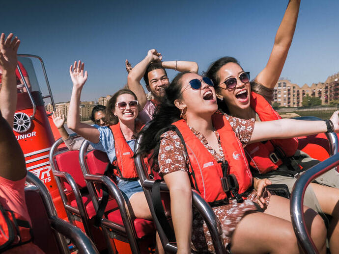 Screaming passengers on a Thames Rocket speed boat