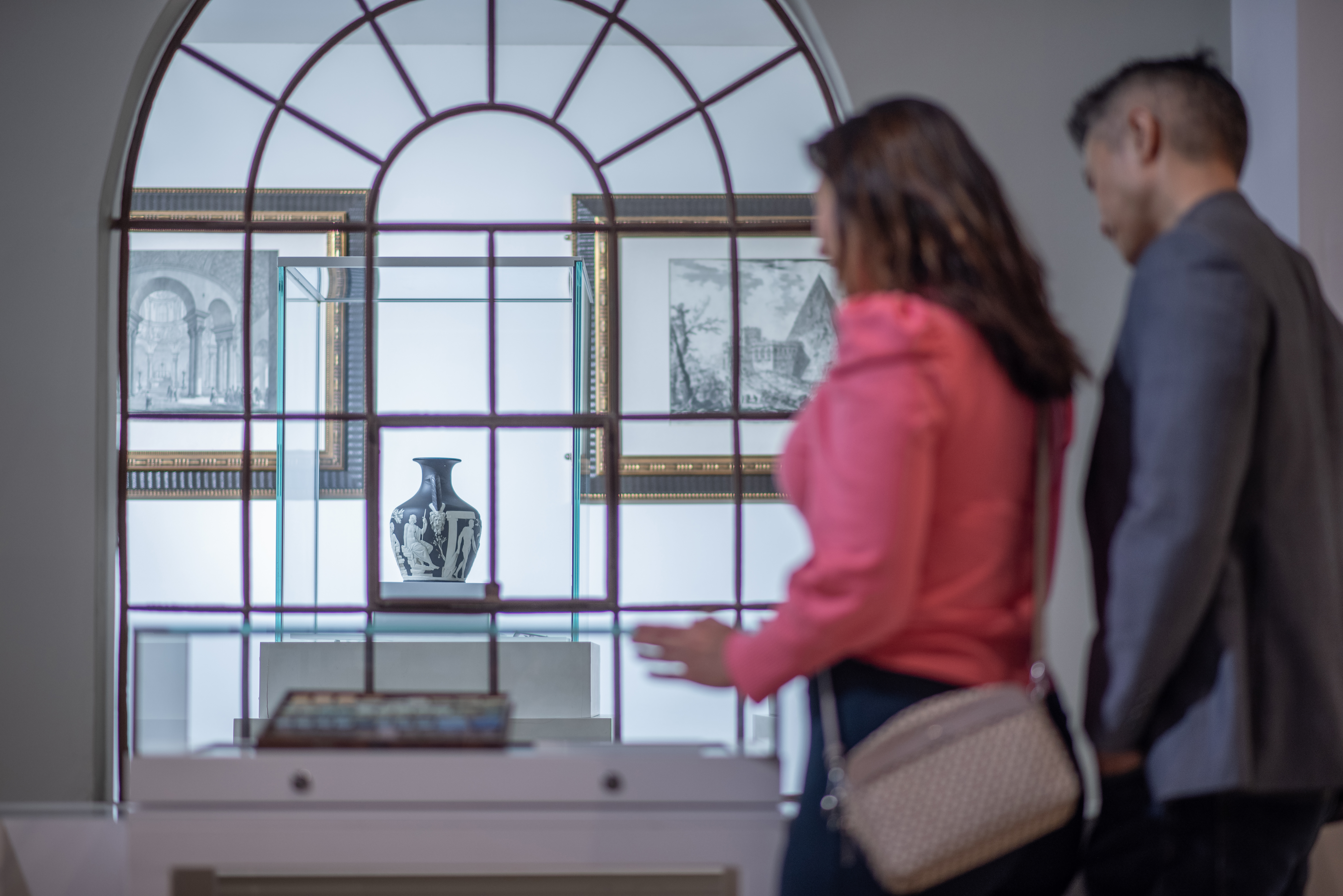 A woman and a man tour a museum