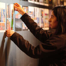 Woman arranging display in a museum