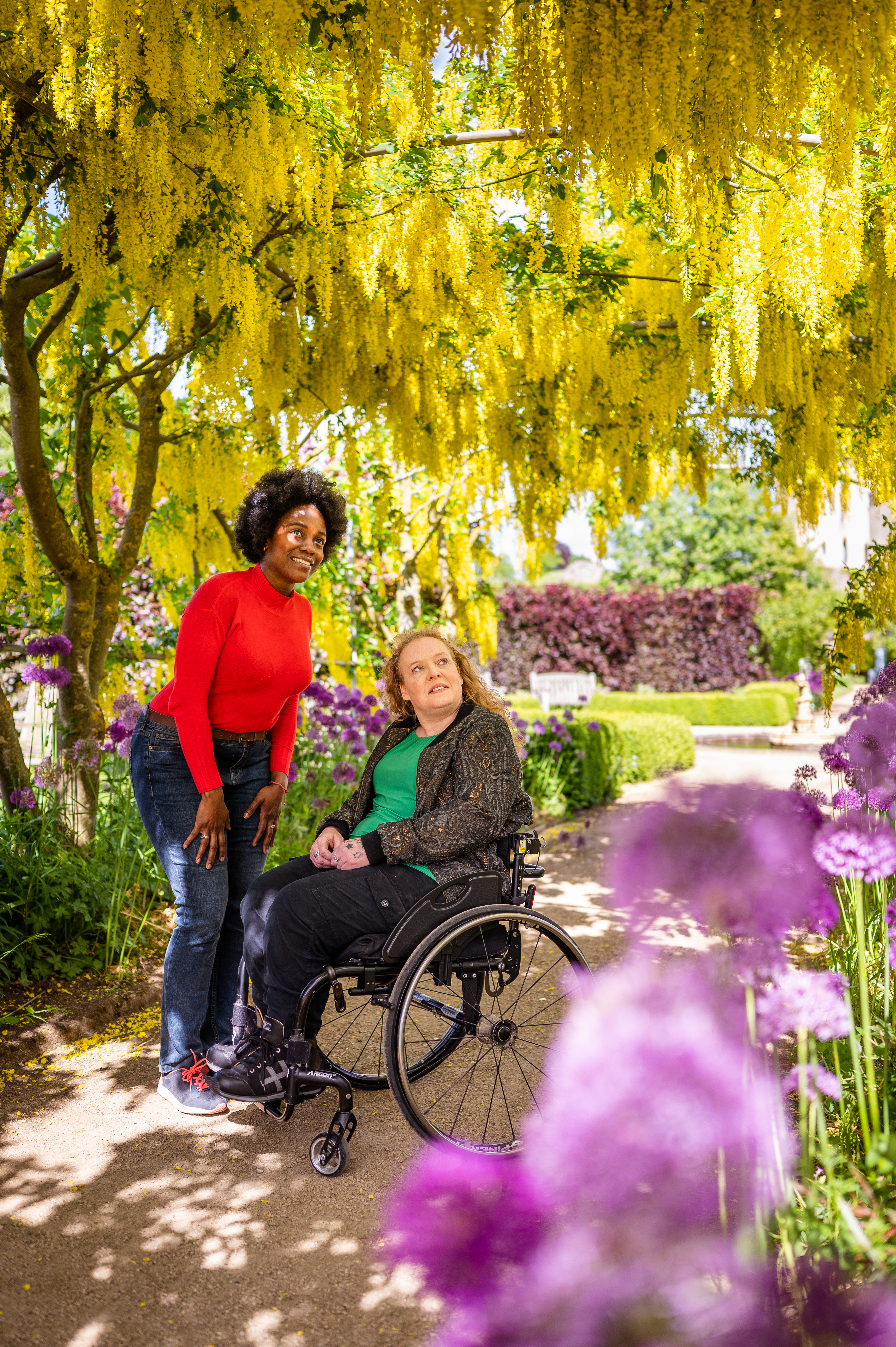 Two women in Helmsley Walled Garden, one using a wheelchair