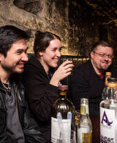 A group of people having a drink in an underground cellar in Edinburgh’s Old Town