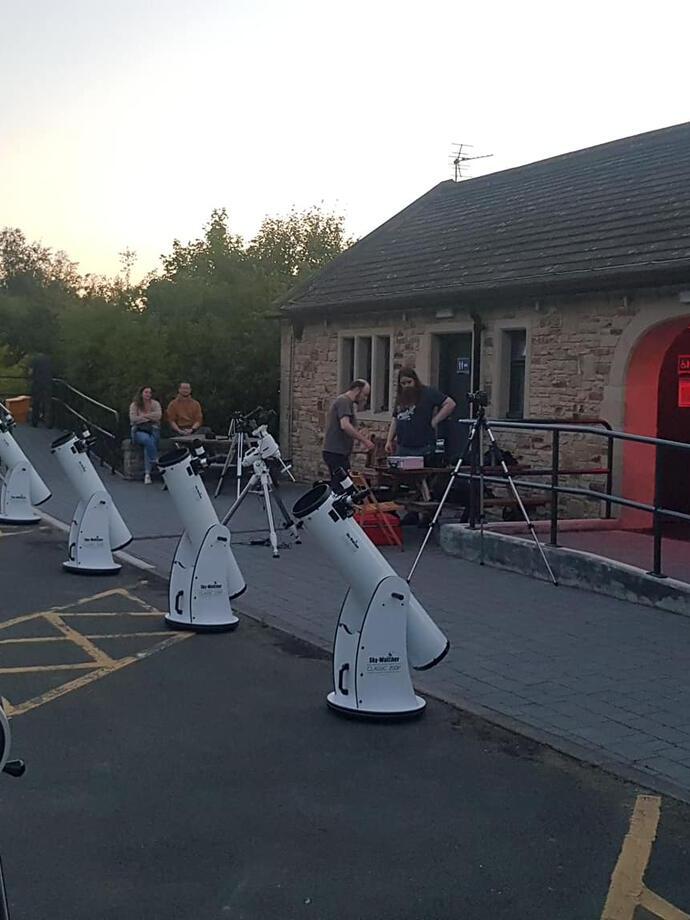 Rows of telescopes being prepared for an evening of stargazing at Grassholme Observatory, Durham
