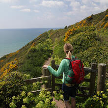 Woman hiking on coastal path